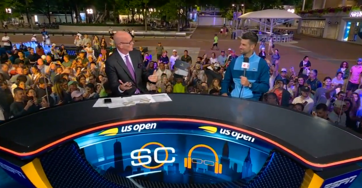 ESPN host Scott Van Pelt speaks with Novak Djokovic at the 2024 U.S. Open.