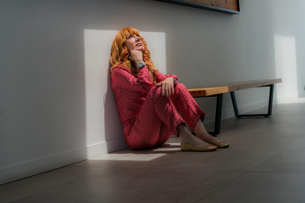 Woman sitting on the floor under natural light of a skylight