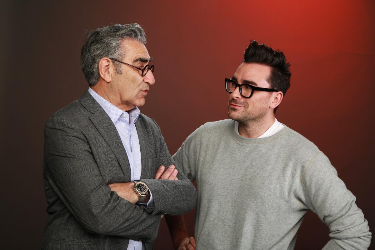 two men in glasses looking at one another