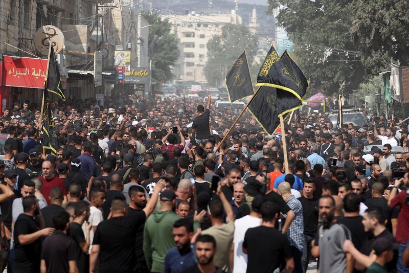 The Israel Defense Forces killed five Palestinians in an drone airstrike early Wednesday in the occupied northern West Bank. Israel has been conducting raids for days in the Jenin, Tubas and Tulkarm areas. Pictured is a funeral procession in the Jenin refugee camp, Friday. Photo by Ismael Ahmad/UPI