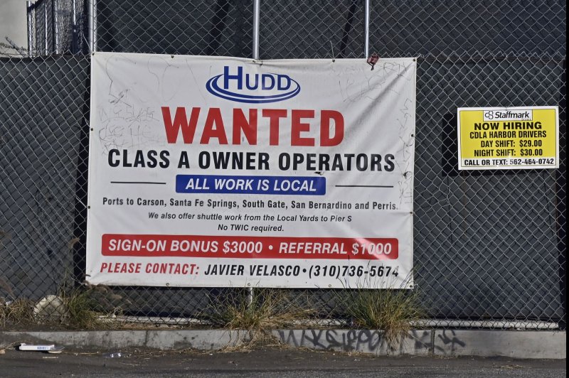 A "now hiring" banner is seen outside Hudd Transportation in South Gate, California on January 27, 2021. The Labor Department said the economy created 142,000 jobs in August. File Photo by Jim Ruymen/UPI