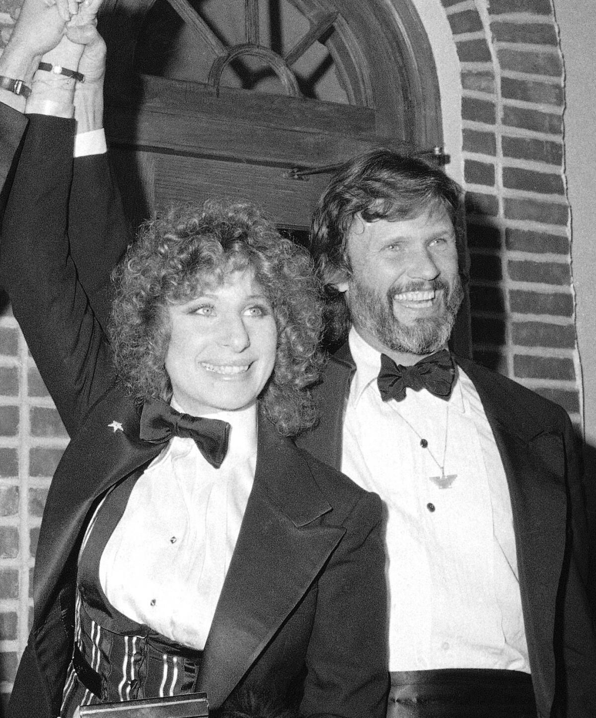 Barbra Streisand, left, and Kris Kristofferson appear at a preview of the film "A Star Is Born." 