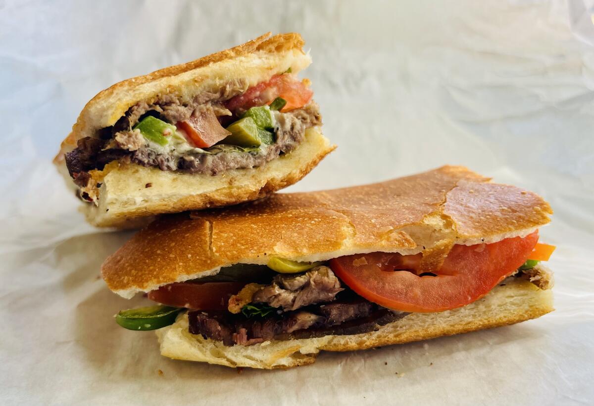 Beef tongue sandwich with tomatoes, pickle and jalapeño from Torino in Pasadena.