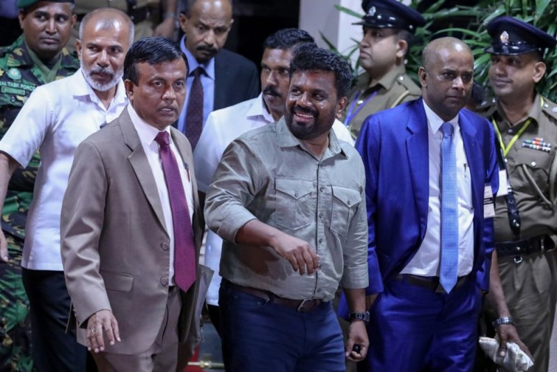 Anura Kumara Dissanayake (center) appears Sunday before the media in Colombo, Sri Lanka, after the announcement of his victory in Sri Lanka's presidential election. Photo by Chamila Karunarathne/EFE/EPA