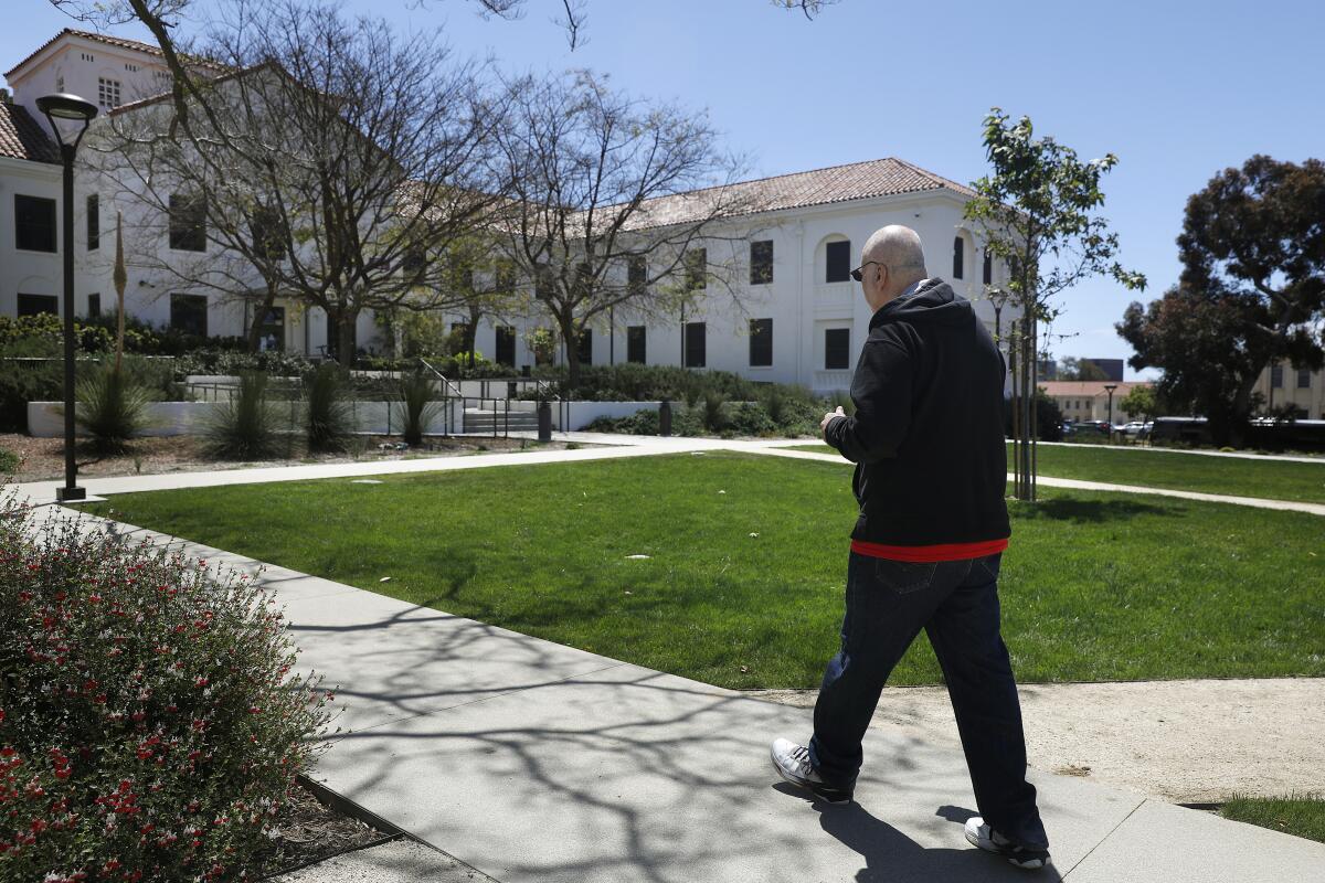 Air Force veteran Robert Keakemety, 69, walks towards the VA's West Los Angeles Campus.