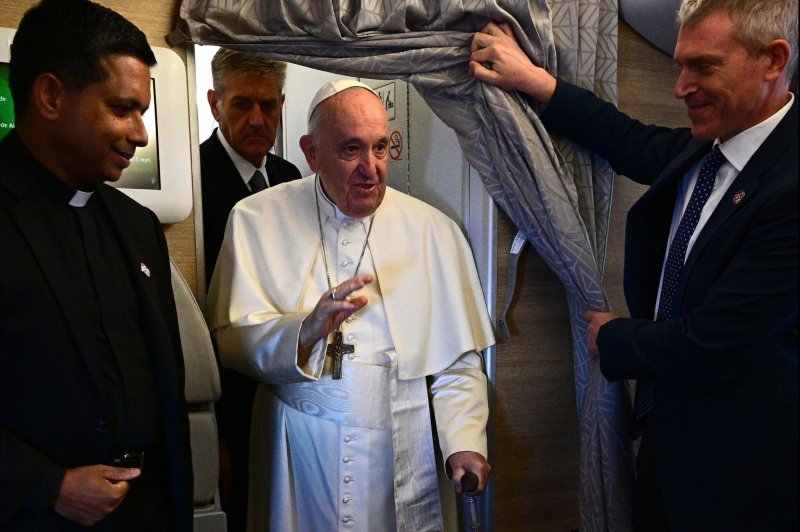 Pope Francis greets journalists as he boards a flight to Edmonton International Airport on July 24, 2022. File photo by Vincenzo Pinto/EPA-EFE