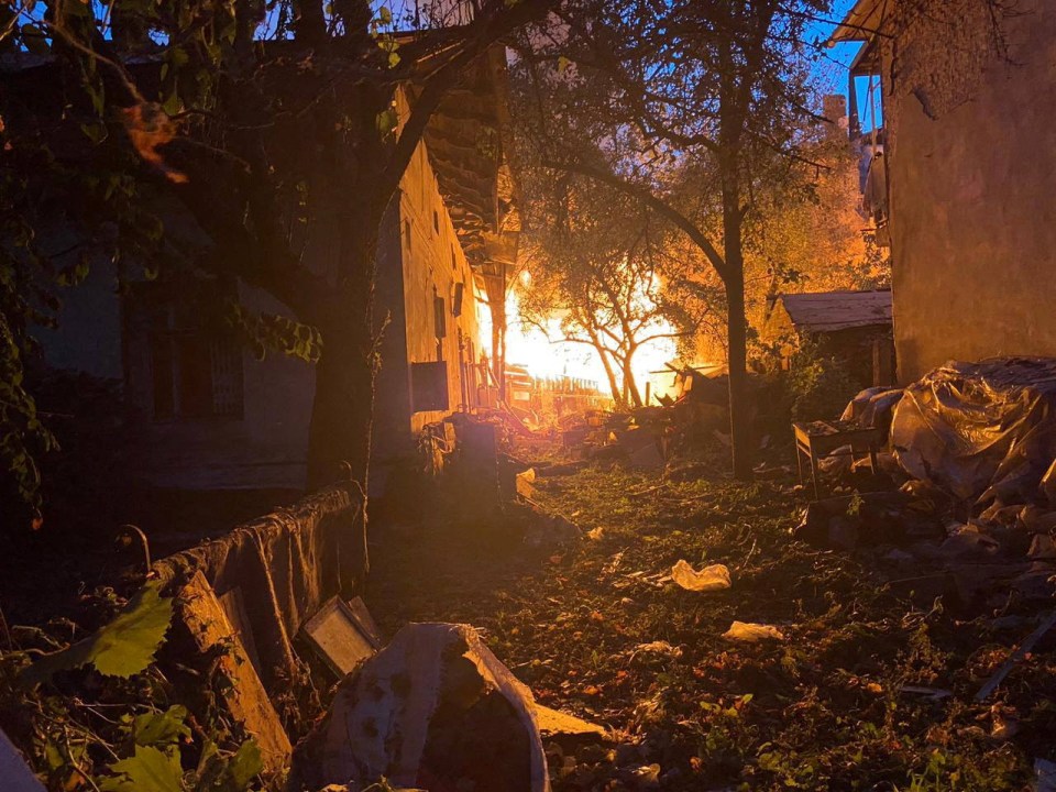 A view shows a burning residential building damaged during a Russian drone and missile strike, amid Russia’s attack on Ukraine, in Lviv