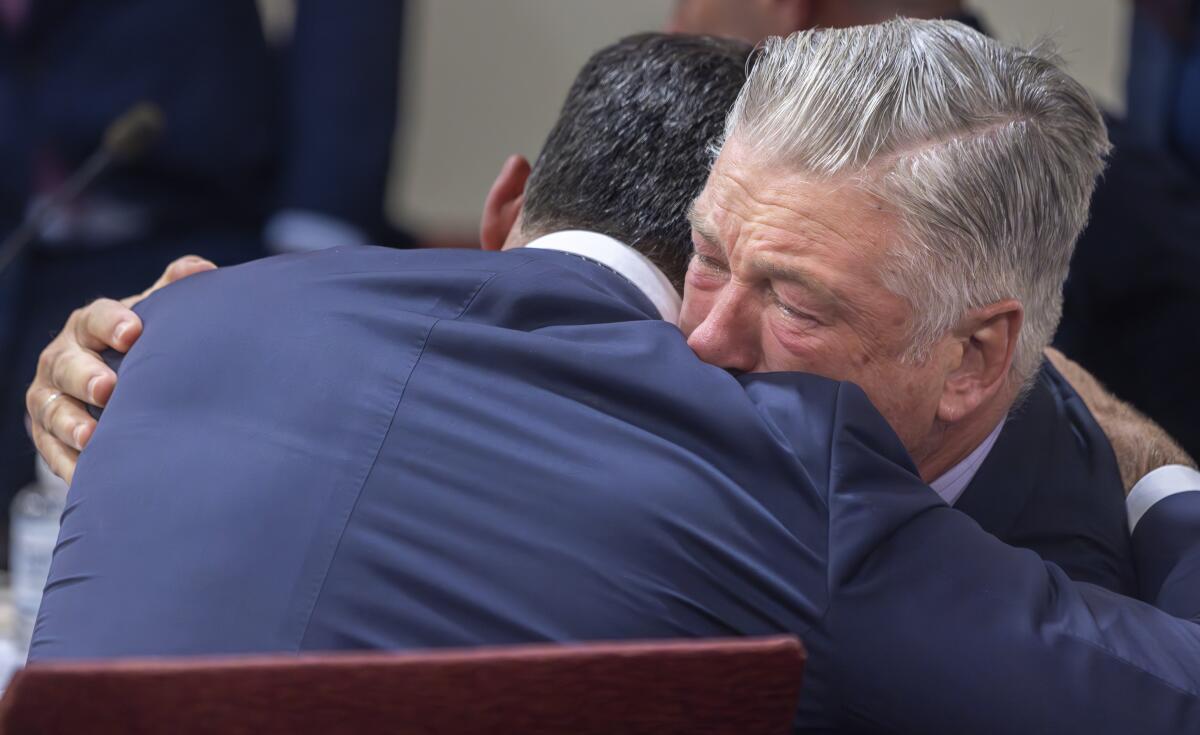 Actor Alec Baldwin, right, hugs his defense attorney Alex Spiro. 