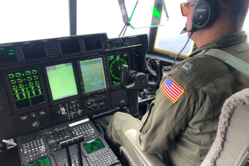 A U.S. Coast Guard crew member aboard an HC-130 Hercules airplane searches for the 21-foot Titan submersible approximately 900 miles East of Cape Cod in Boston in June, 2023. The Titan was carrying tourists to the site of the Titanic wreckage. File Photo by U.S. Coast Guard Petty Officer 1st Class Amber Howie/EPA-EFE