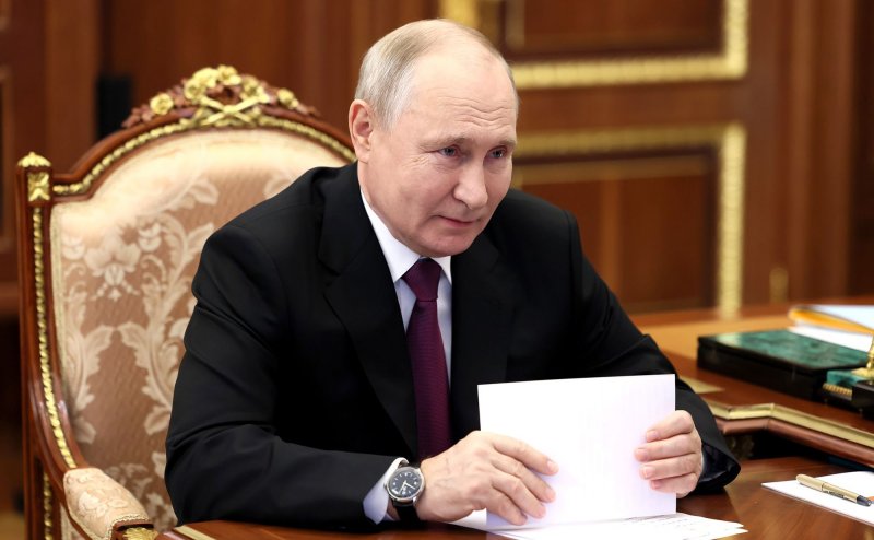 Russia's President Vladimir Putin (L) seen attending a meeting on Sept.. 28, 2023. On Thursday, 10 countries, including the United States, accused Russia of orchastrating wide-ranging cyberattacks targeting Ukraine and NATO countries going back as far as 2020. File Photo by Kremlin Pool/UPI