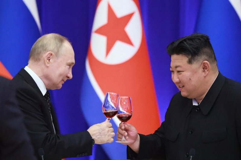 Russian President Vladimir Putin (L) and North Korean leader Kim Jong Un make a toast during a state reception at the Reception House in Pyongyang, North Korea, in June 2024. On Thursday, the United States sanctioned a banking network that facilitated the transferring of funds between the two countries. File photo by Vladimir Smirnov/Sputnik/EPA-EFE