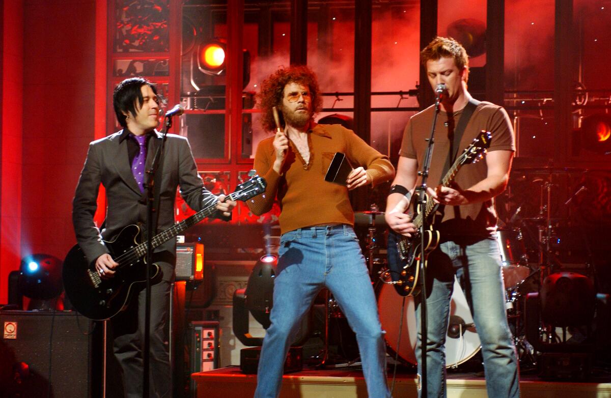 Will Ferrell as Gene Frenkle from "More Cowbell," onstage with musical guests Queens of the Stone Age.