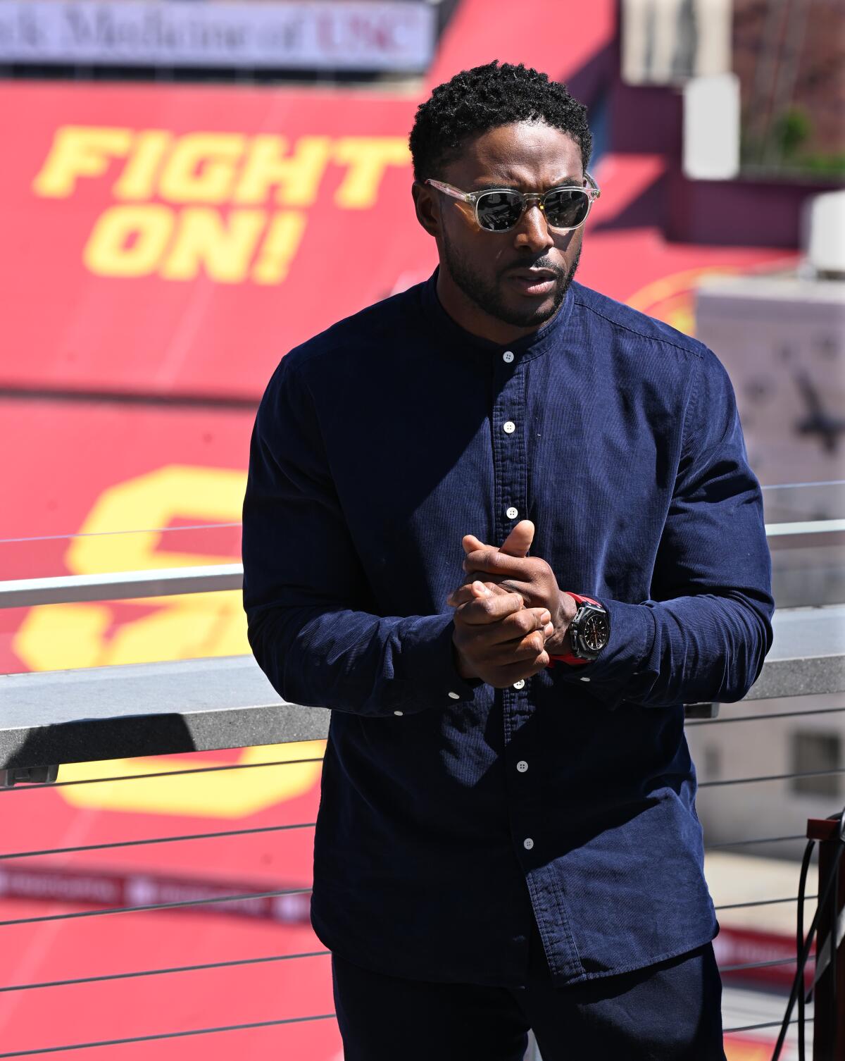 Former USC running back Reggie Bush speaks at a press conference at the Coliseum in August 2023.