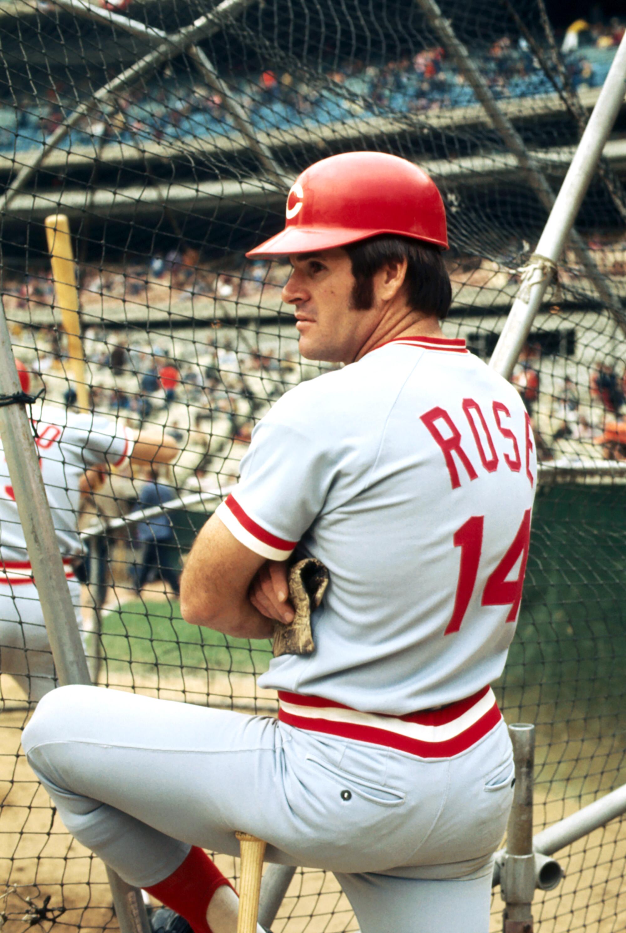 Cincinnati Reds legend Pete Rose stands on the field during batting practice.