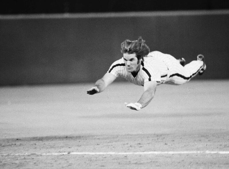 Philadelphia's Pete Rose slides to third base during a baseball game against the New York Mets in June 1981.