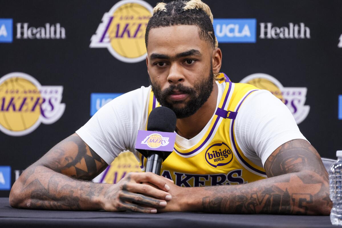 Lakers guard D'Angelo Russell listens intently to a question from a reporter during media day.