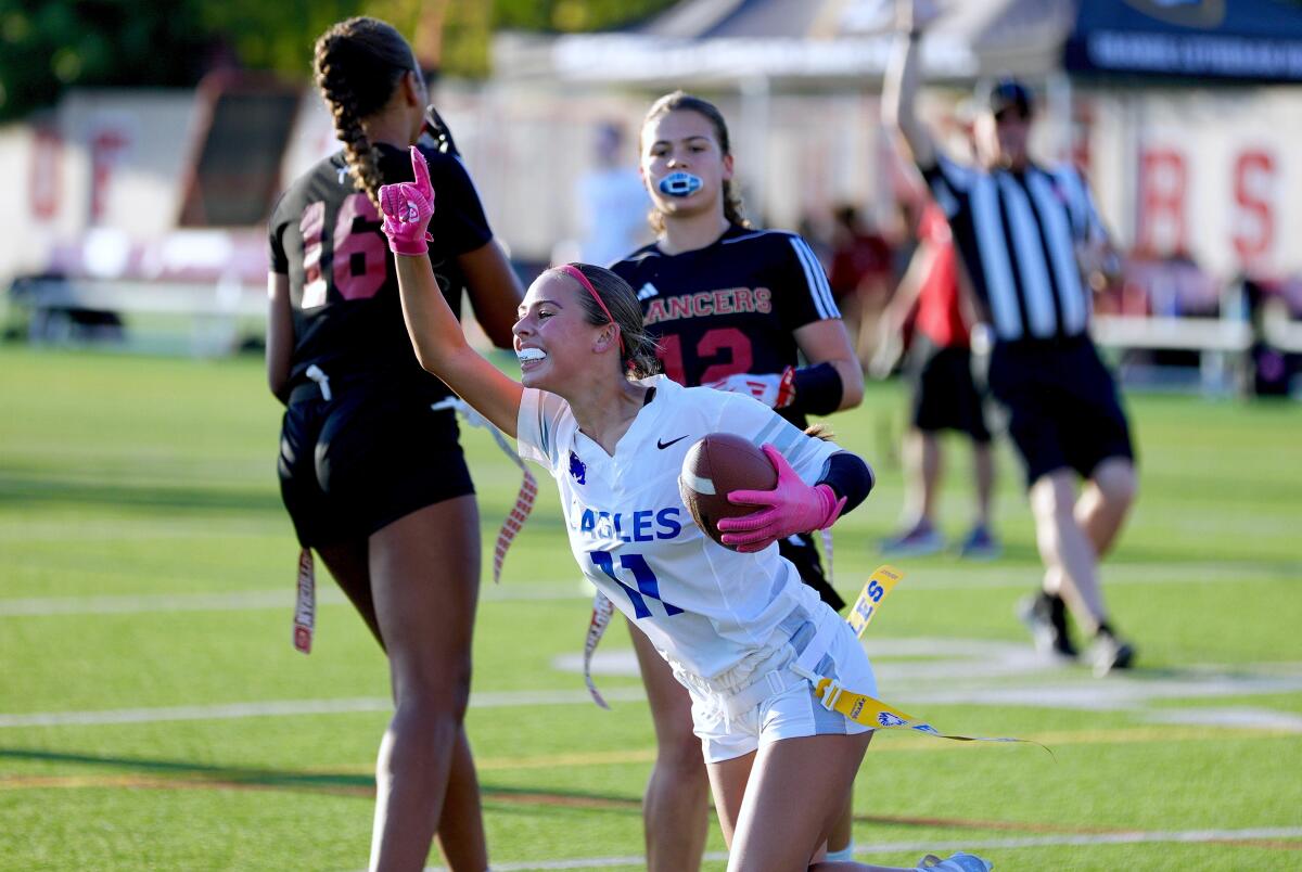 Santa Margarita receiver Fiona Agius celebrates a touchdown catch in the first half against Orange Lutheran.