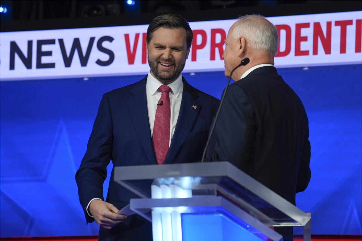 JD Vance and Tim Walz talk after the debate.