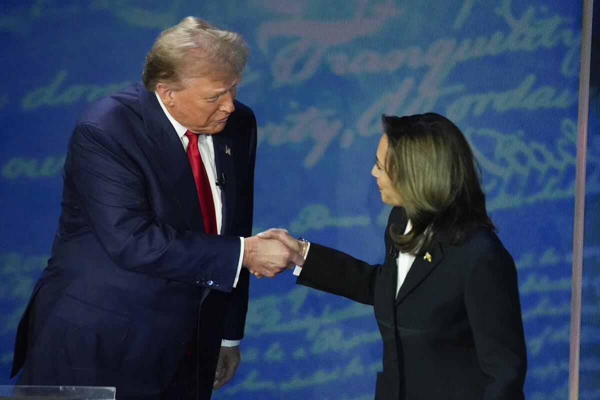 Donald Trump and Kamala Harris shake hands before the start of their September debate.