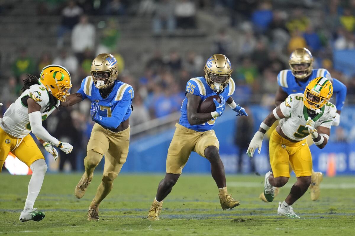 UCLA running back T.J. Harden ran for 53 yards against Oregon. 