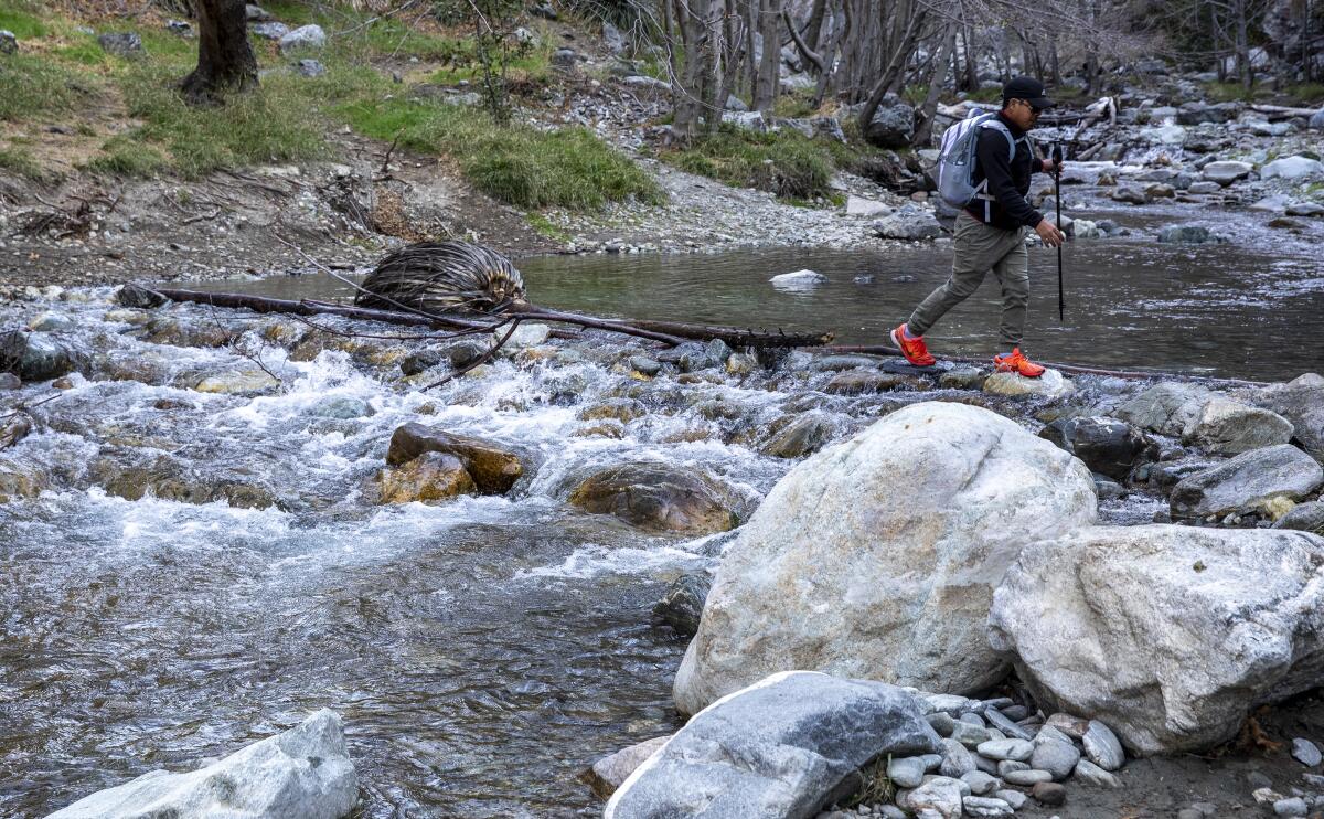 A man crosses a river