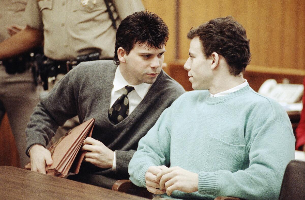 Lyle Menendez, left confers with brother Erik during a court appearance, April 2, 1991 in Beverly Hills