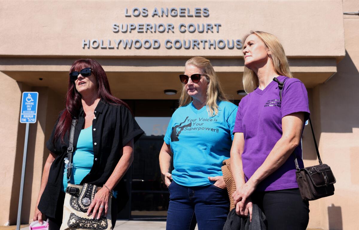 Antelope Valley residents Diane Swick, Cynthia Farrow, and Mary Jeters, from left, exit the Hollywood Courthouse.