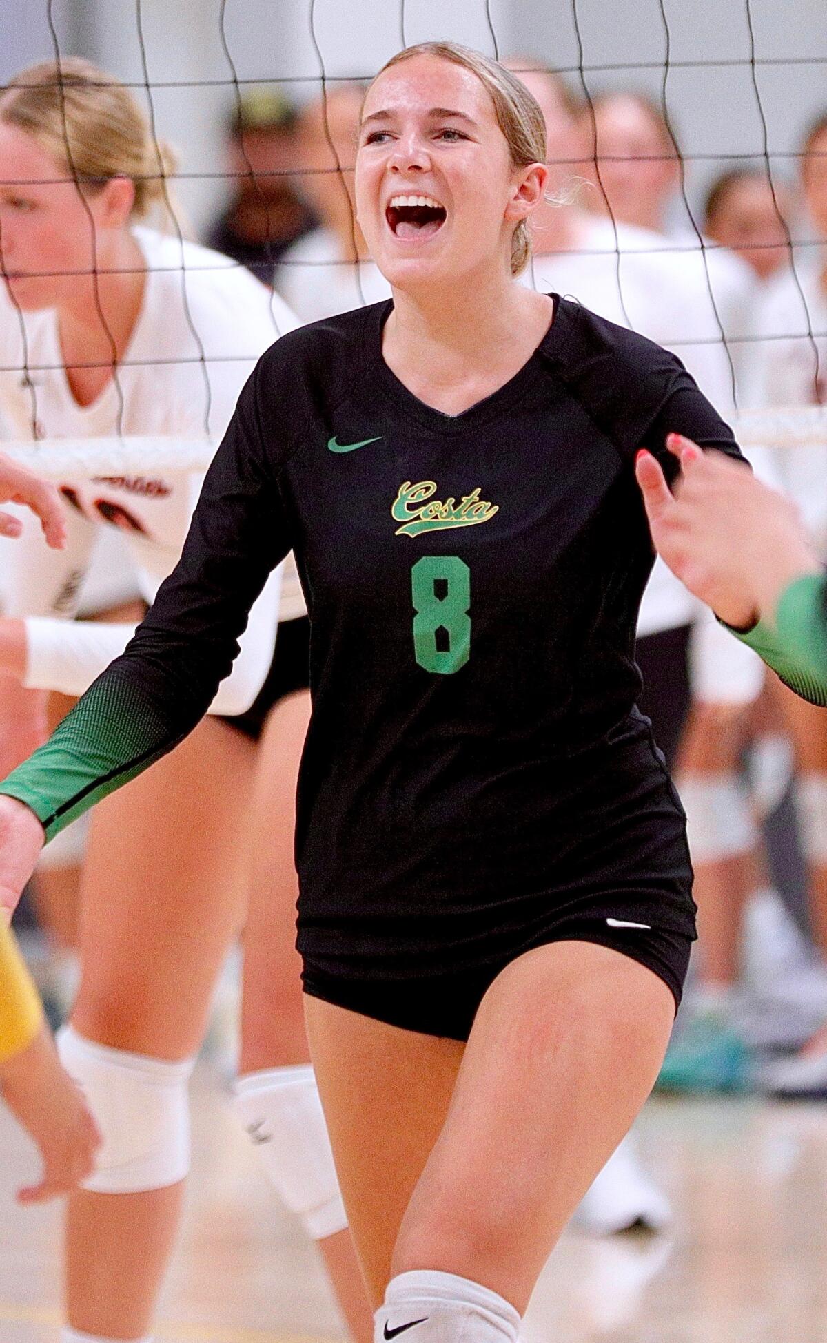 Mira Costa junior setter Milly McGee smiles after the Mustangs won a point