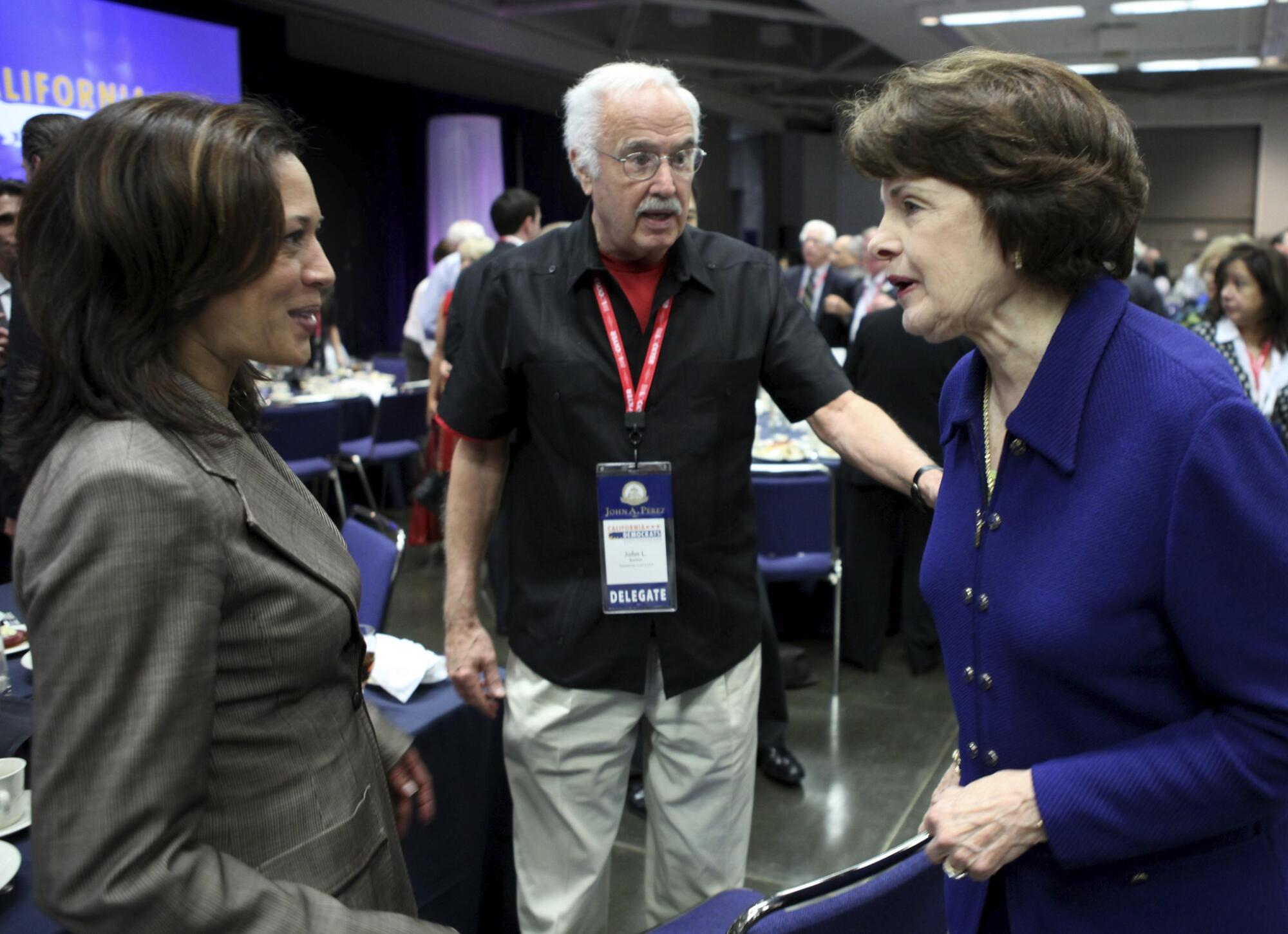 Dianne Feinstein talks with Kamala Harris and John Burton.