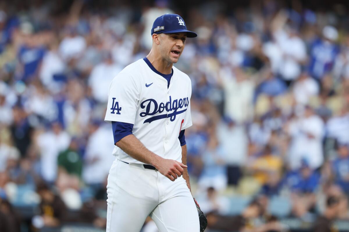 Dodgers pitcher Jack Flaherty walks off the field during Sunday's loss to the Padres.