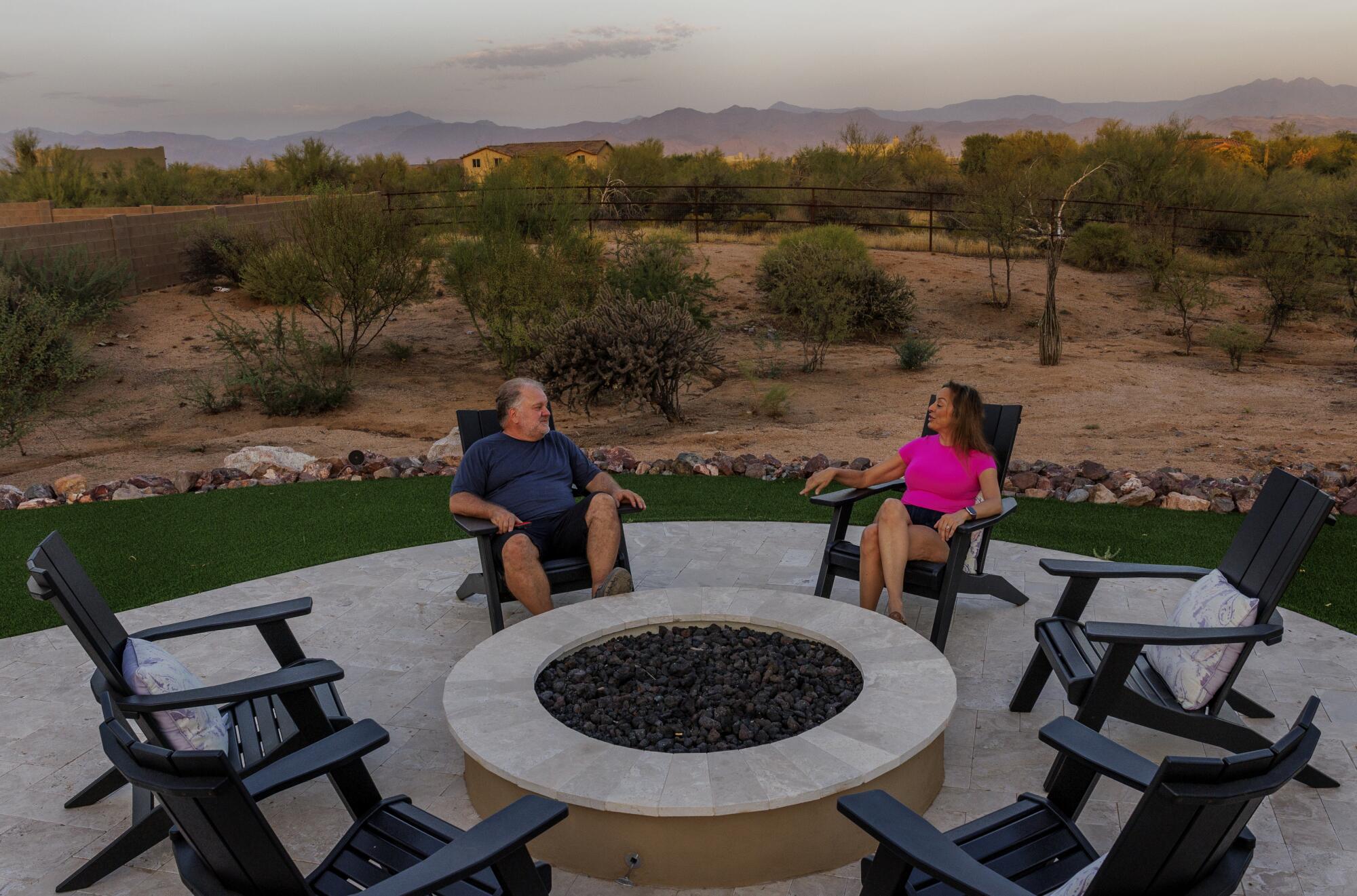 Former California residents Mike and Michele Pitek enjoy their back yard in Scottsdale with stunning desert views.