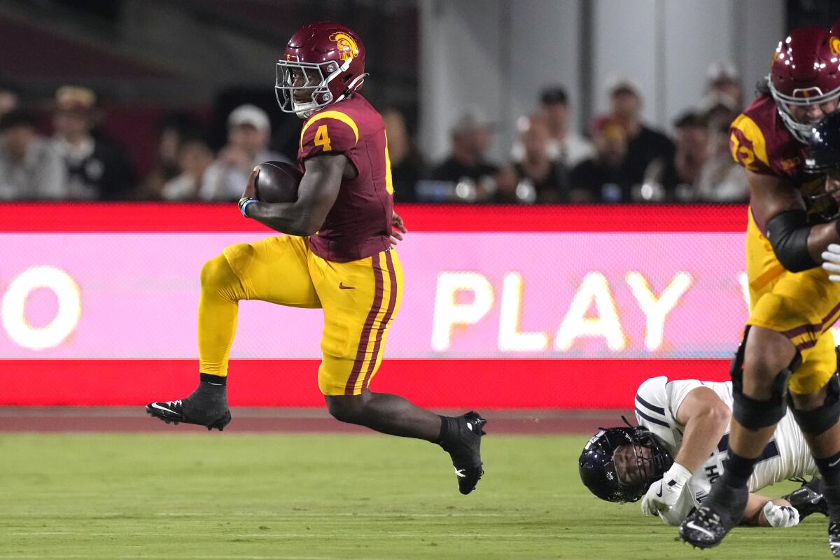 Woody Marks runs the ball against Utah State on Sept. 7.