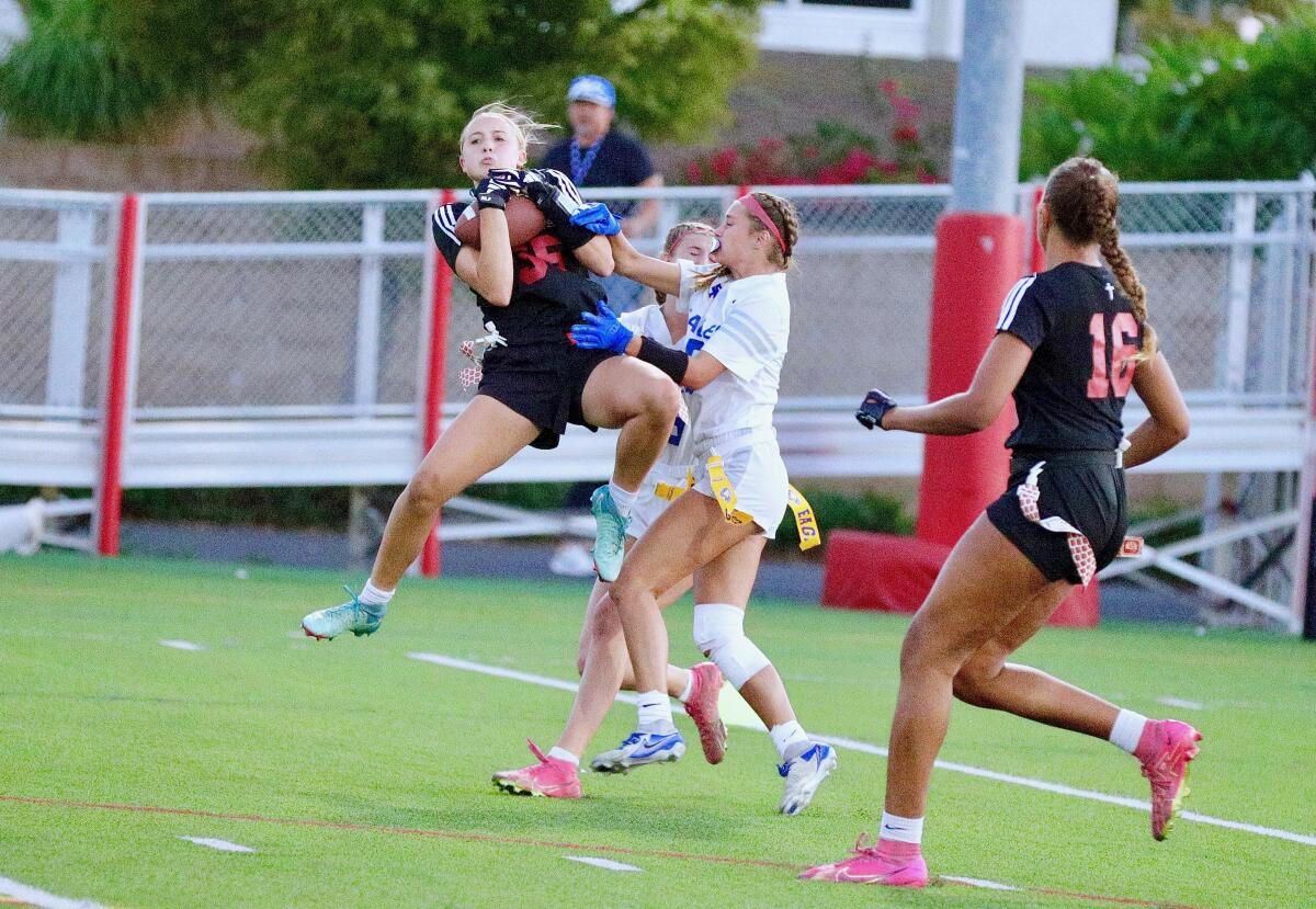 Josie Anderson intercepts a pass in the end zone to preserve Orange Lutheran's 20-13 victory.