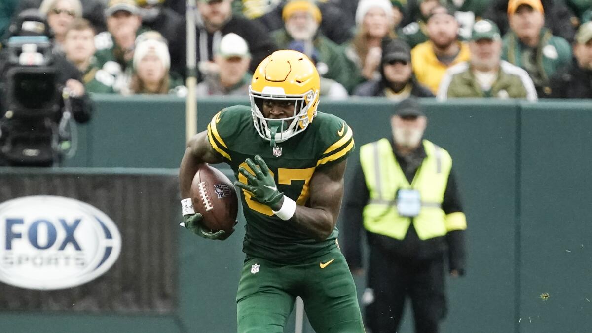 Green Bay Packers' Romeo Doubs runs during the first half of an NFL football.