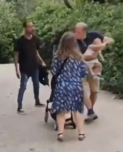 The baby's family quickly take her away from the perpetrator and walk the other direction