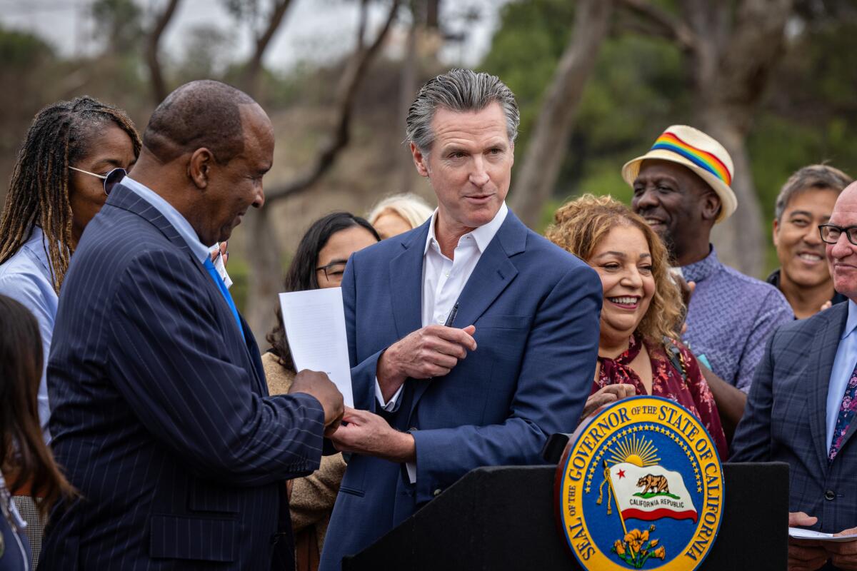 Gov. Gavin Newsom speaks at a news conference in Inglewood.