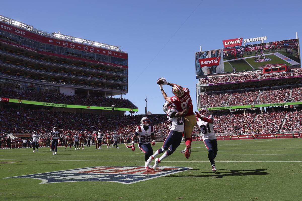 San Francisco 49ers tight end George Kittle catches a touchdown pass 