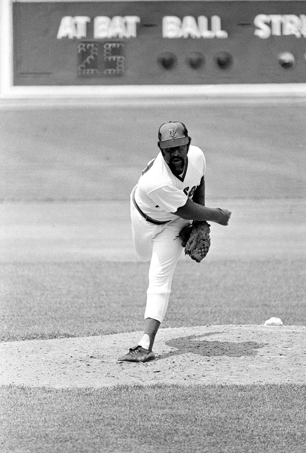 Red Sox pitcher pitcher Luis Tiant delivers a pitch against the Orioles at Fenway Park in 1974.