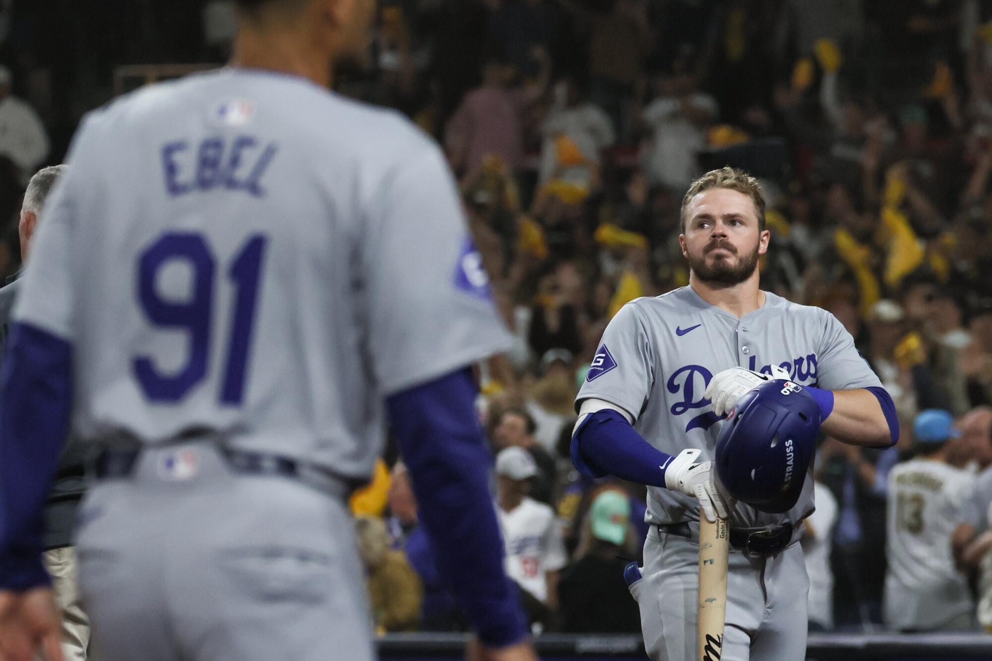 Dodgers batter Gavin Lux reacts after striking out in the ninth inning to end the game Tuesday against the Padres.