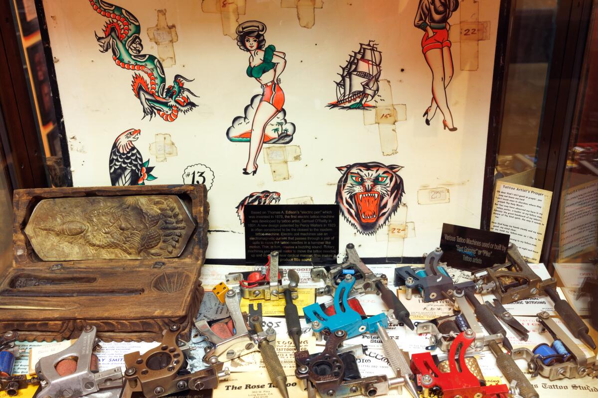 A display case featuring flash and tools at Outer Limits Tattoo and Museum.