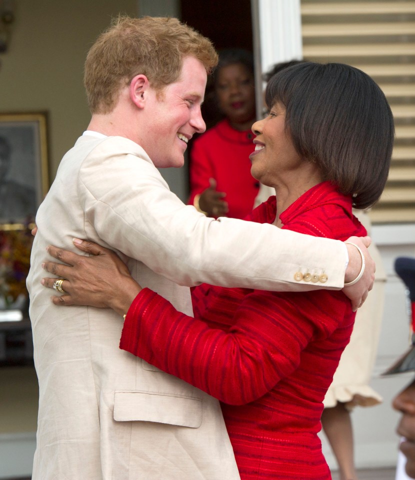 Prince Harry warmly greeting Jamaican Prime Minister Portia Simpson-Miller