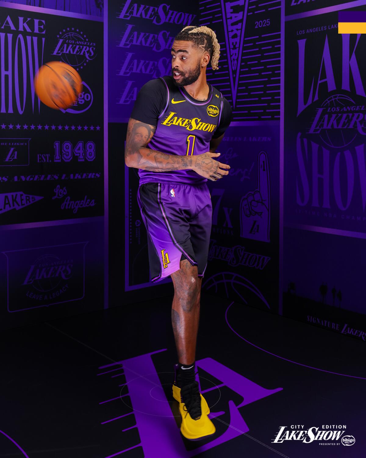 D'Angelo Russell tosses a ball behind his back as he models the new City Edition uniform.