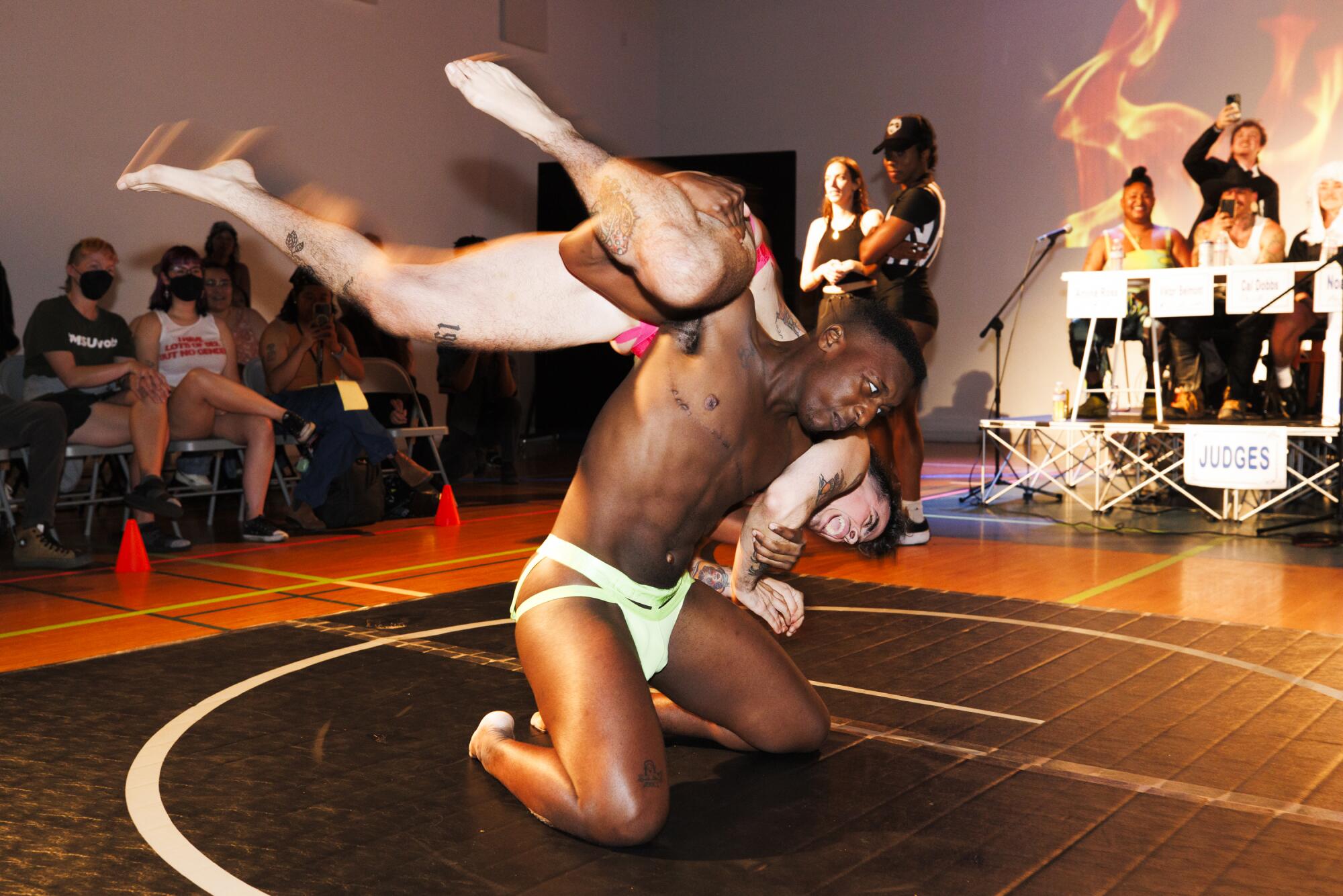 Two wrestlers compete at the Trans Dudes of LA T-Boy Wrestling event.