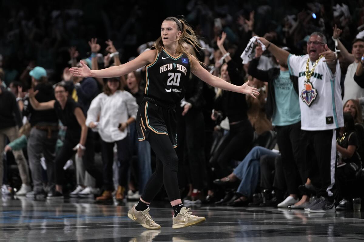 The New York Liberty's Sabrina Ionescu reacts after scoring during Game 1 of the WNBA Finals against the Minnesota Lynx