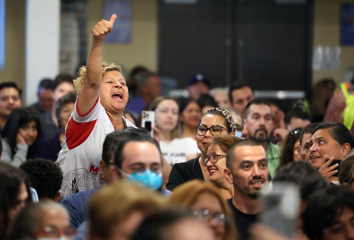 Attendees give their approval during a debate between Kevin de León and Ysabel Jurado in Boyle Heights.