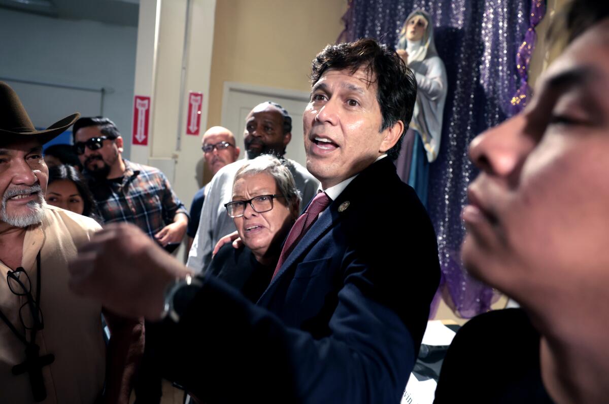 City Council member Kevin de León with constituents at Dolores Mission Church in Boyle Heights.