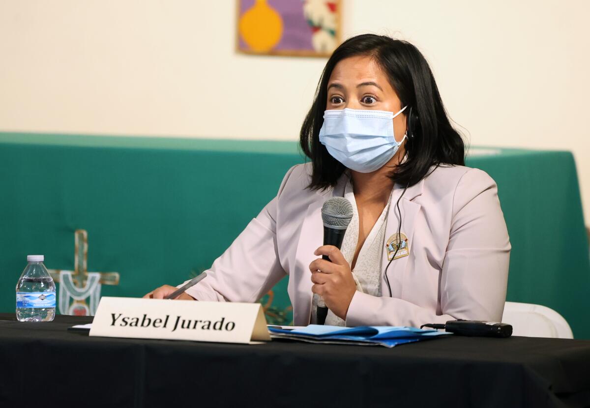 City Council candidate Ysabel Jurado speaks while seated and wearing a mask.