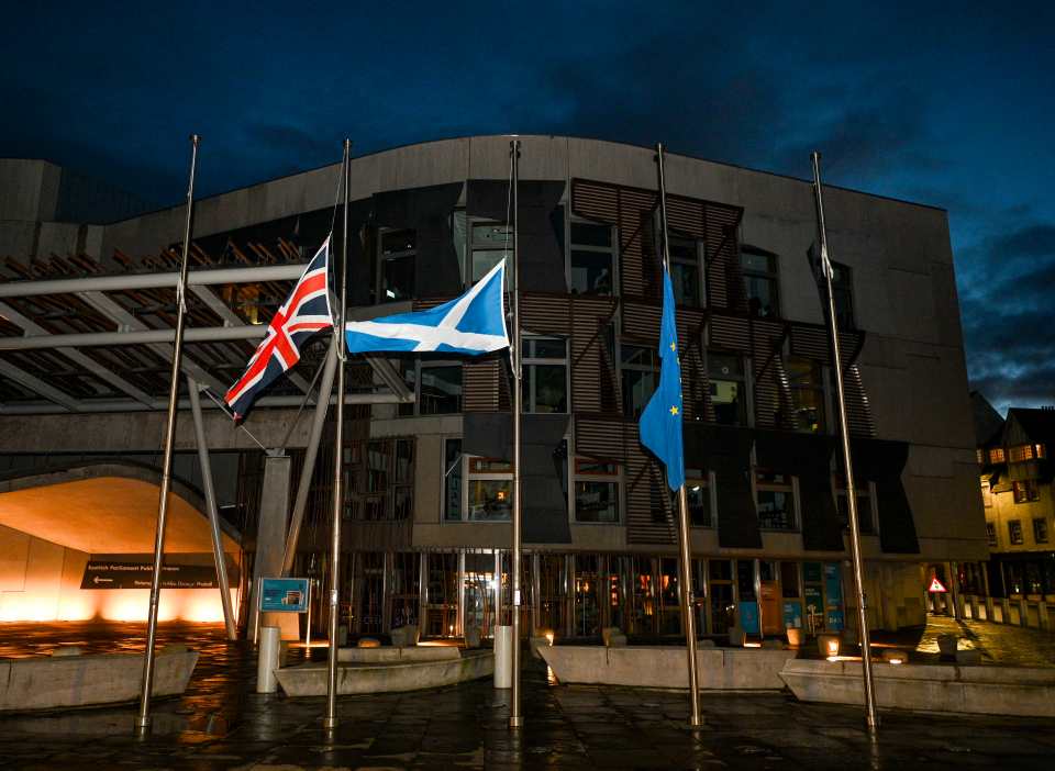 Flags outside the Scottish Parliament are flying at half-mast tonight