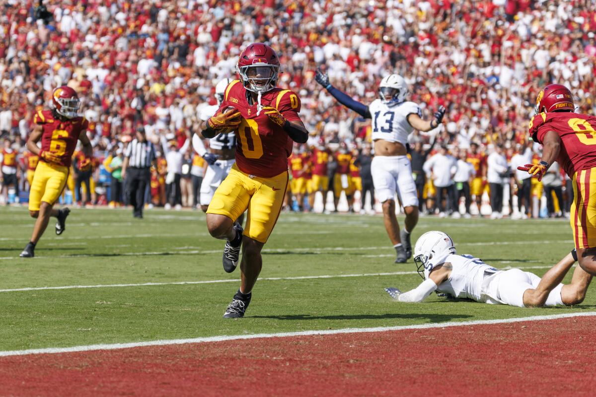 USC running back Quinten Joyner scores on a nine-yard pass from quarterback Miller Moss in the second quarter.