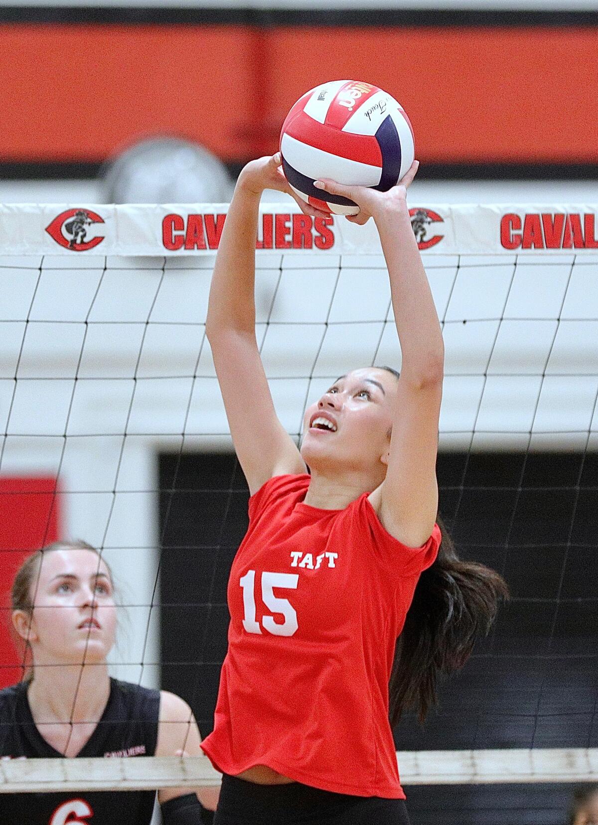 Taft's Francine Baltazar-Shine sets the volleyball during a recent match against Cleveland.